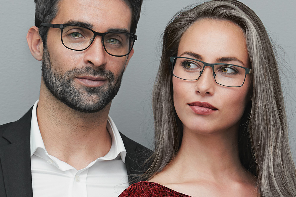 Picture of a woman wearing glasses for the product line of Eagle lenses from FEA Industries.