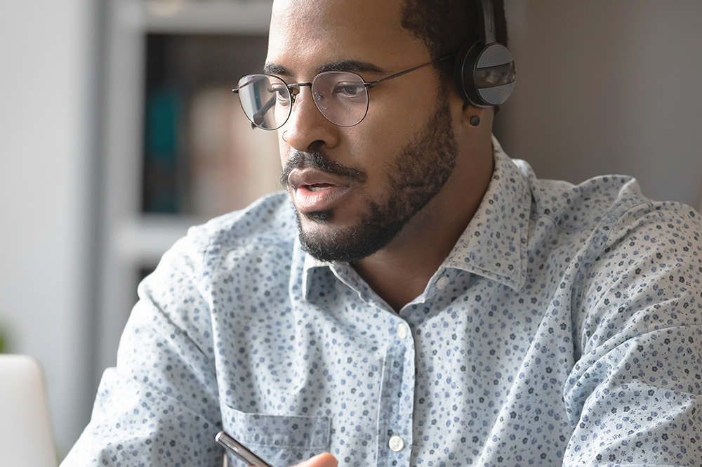 Picture of a man wearing glasses for the product line of Independence Tech lenses from FEA Industries.